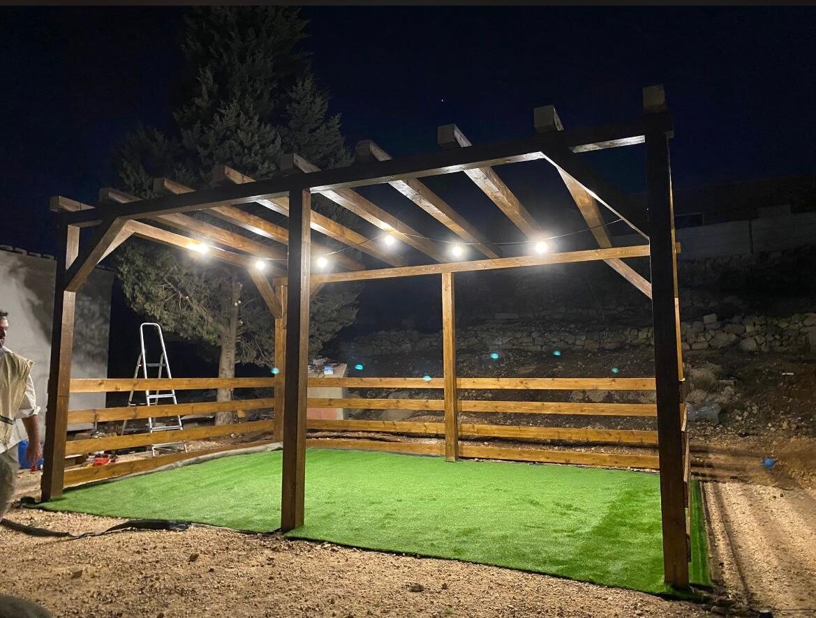 Pergola frame lit up at night