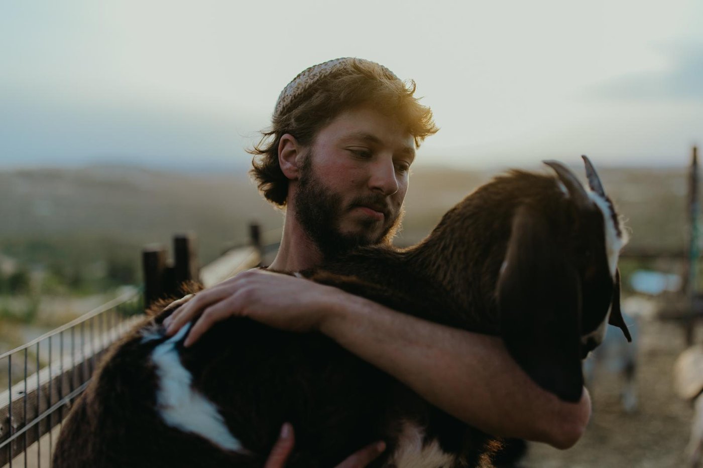 A quiet moment with one of the farm's goats